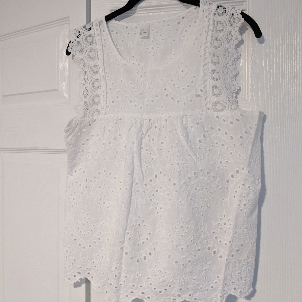 Sleeveless white eyelit top